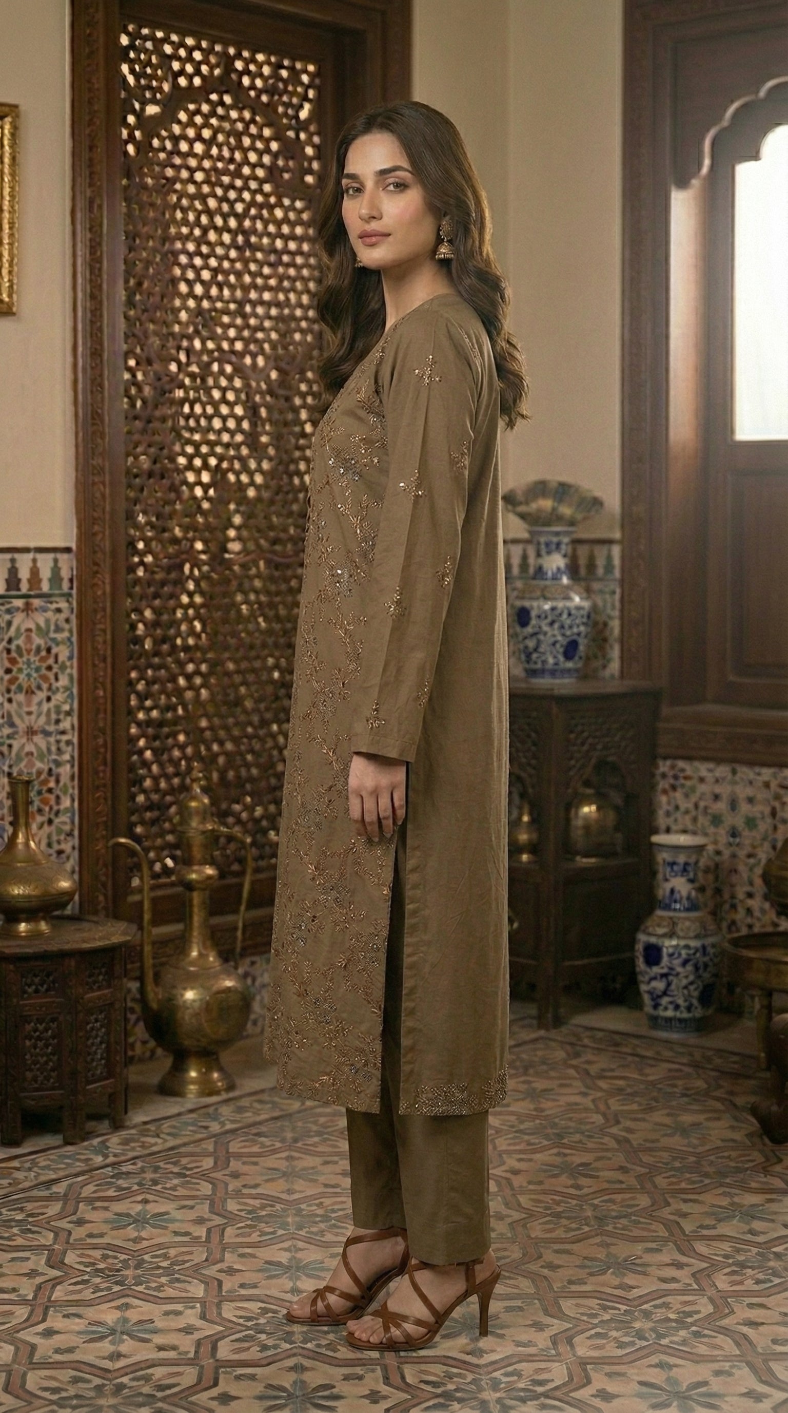 Side profile of elegant olive brown embroidered straight shirt with matching trousers for women.