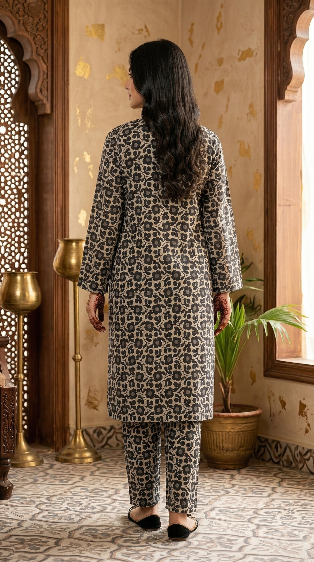 Back view of black and beige floral printed long shirt with coordinated straight trousers.