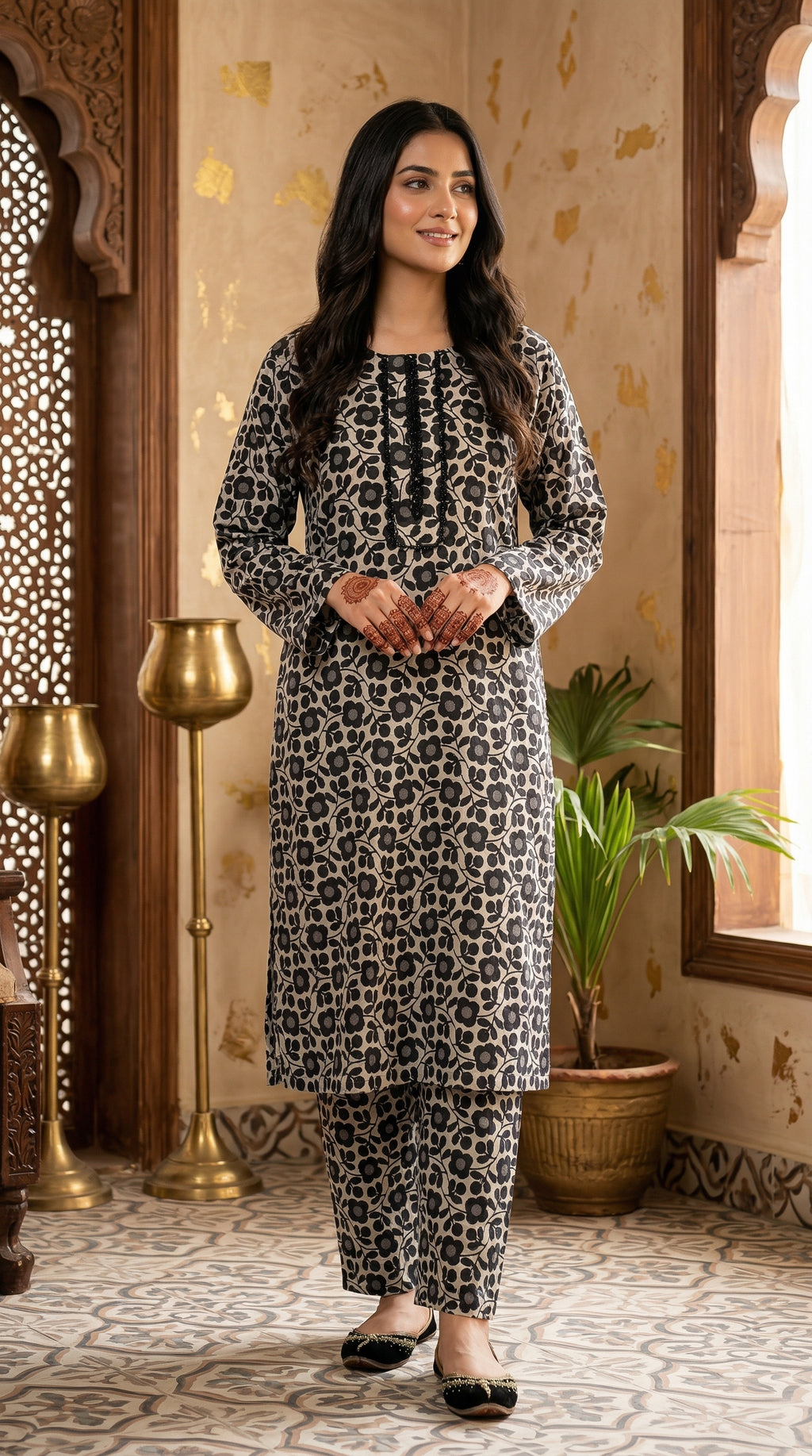 Front view of black and beige floral printed women stitched suit with matching straight trousers.