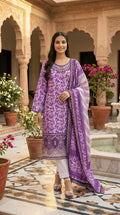 Front view of purple floral suit set with striped dupatta and embroidered neckline